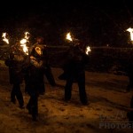 Fox characters carrying flaming torches